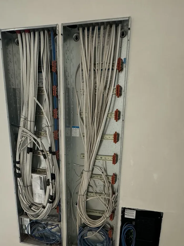 Low-voltage enclosures at rough-in, conductors coiled and unterminated