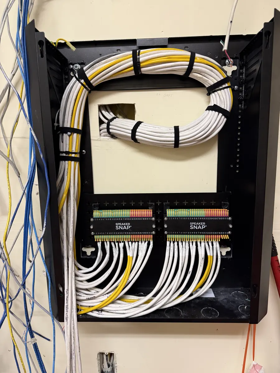 A distribution enclosure mid-dress — loom being swept into final position.